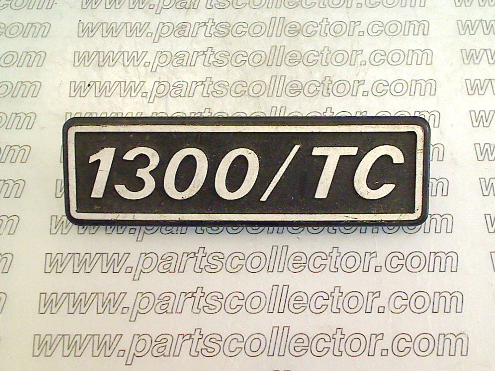 1300 TC BADGE